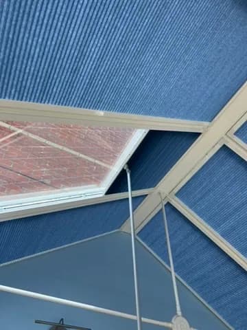 Conservatory roof blind detail against daylight
