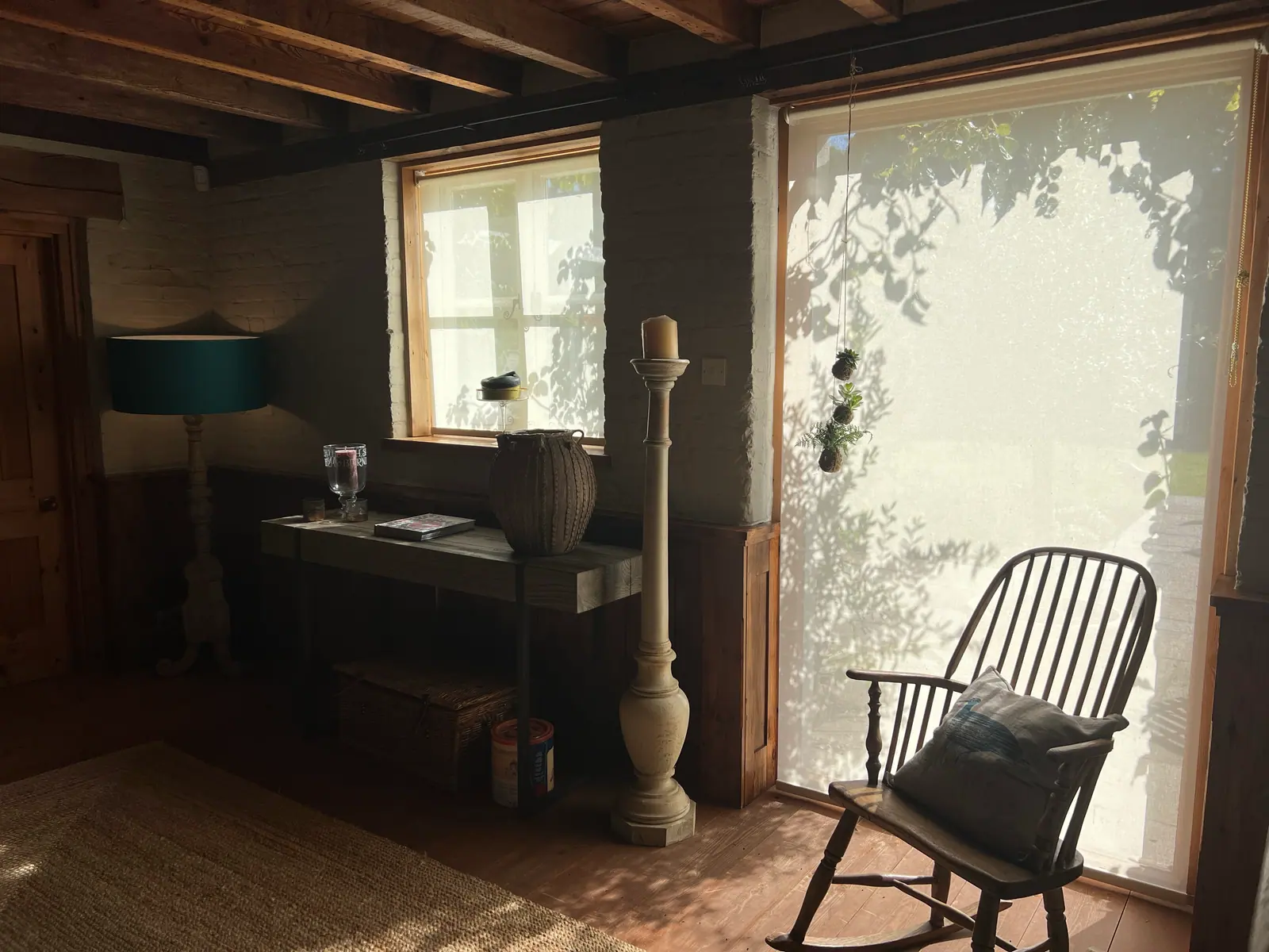 White roller blind in a beamed living room