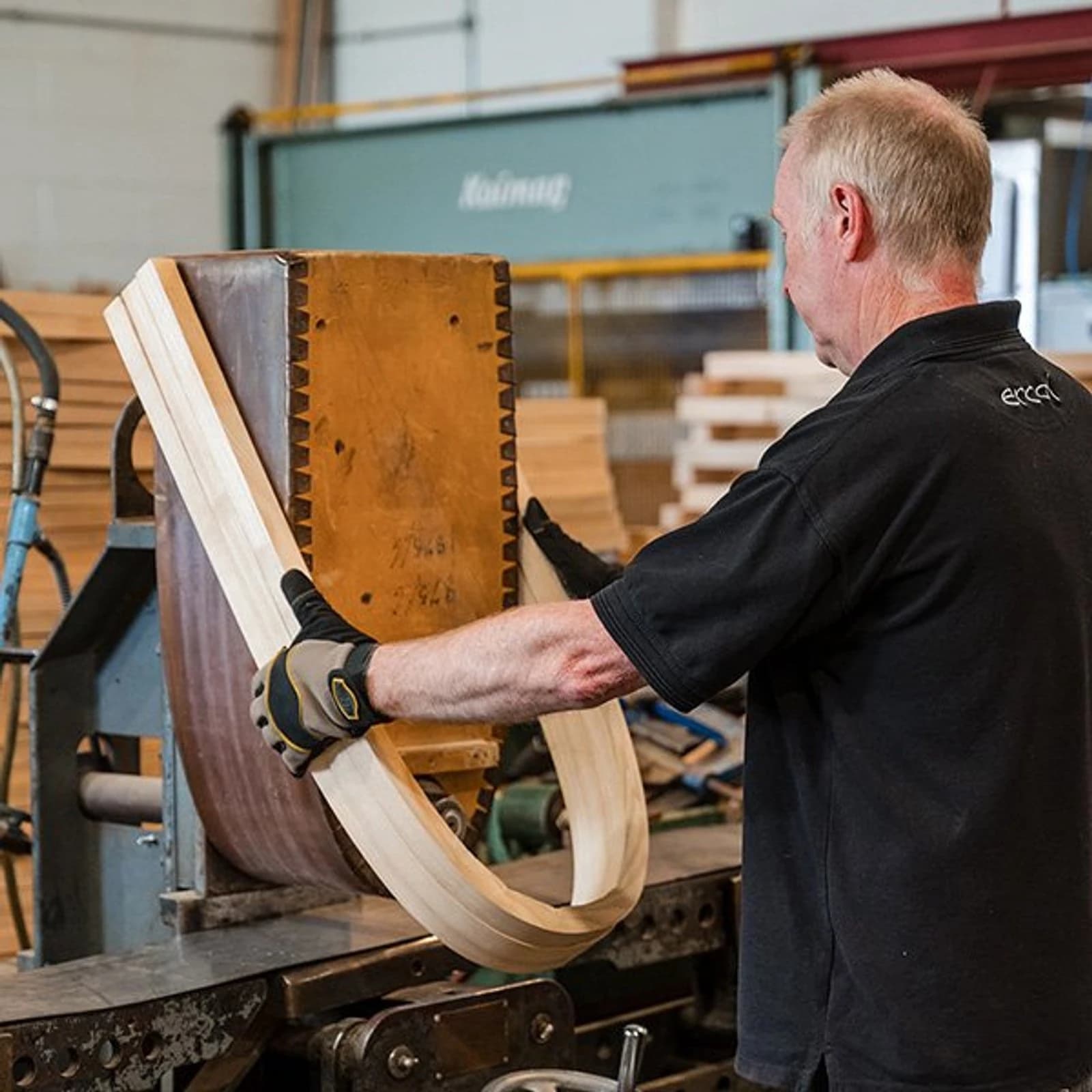 Ercol craftsman steam-bending solid ash for a Quaker chair in the Buckinghamshire factory