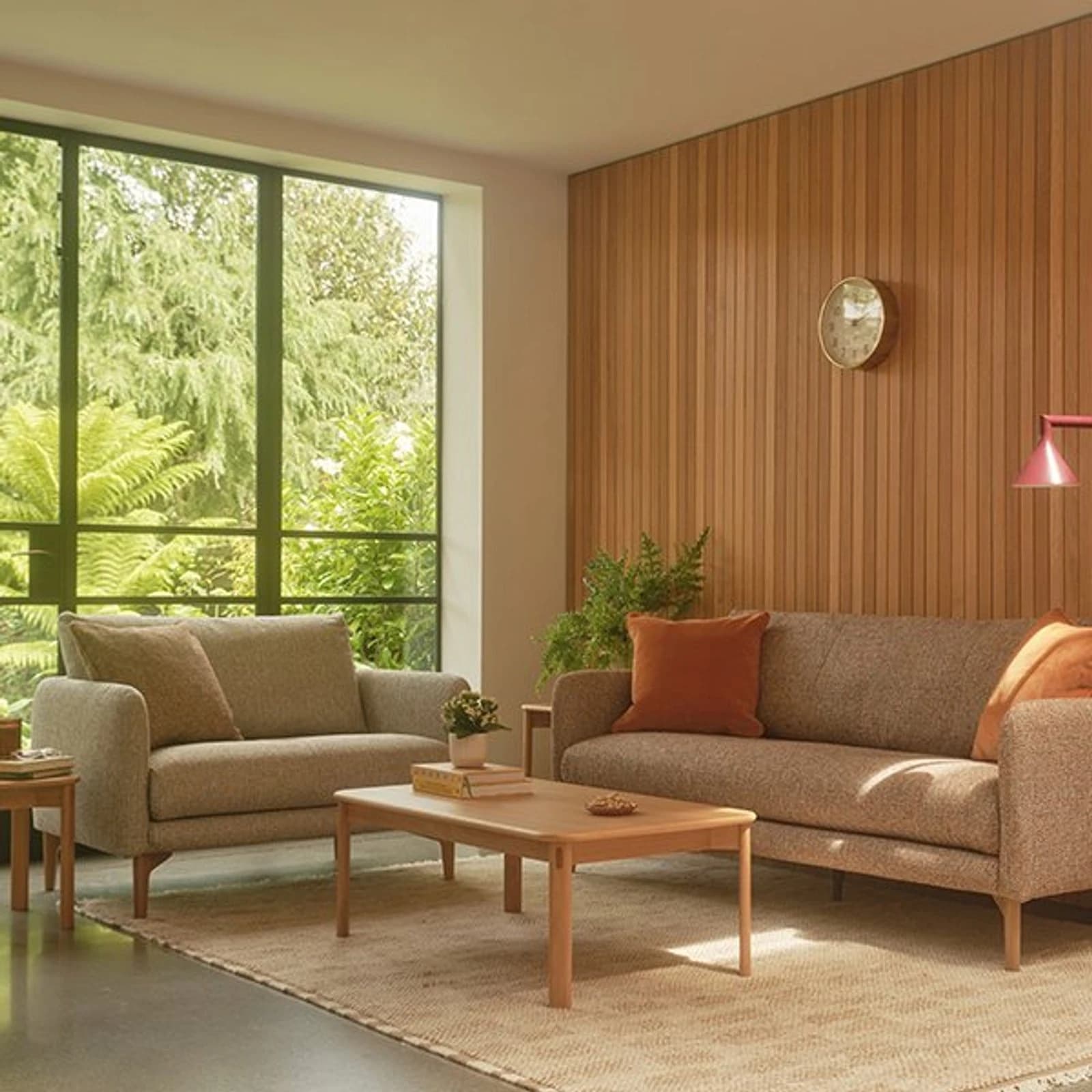 Ercol living room furniture group with sofa, armchair, coffee table and timber shelving