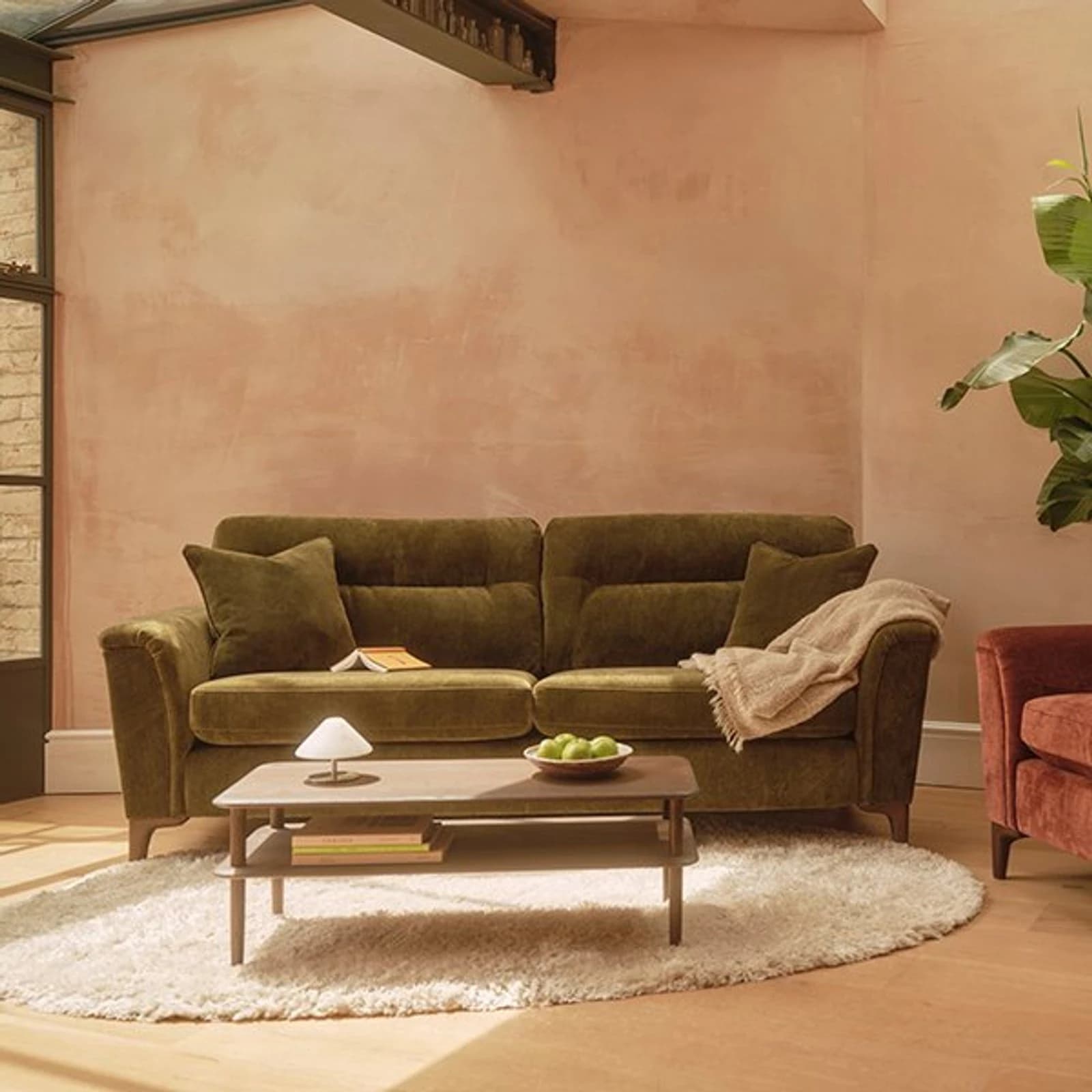 Ercol sofas and lounge seating with timber show-wood frames in a showroom display
