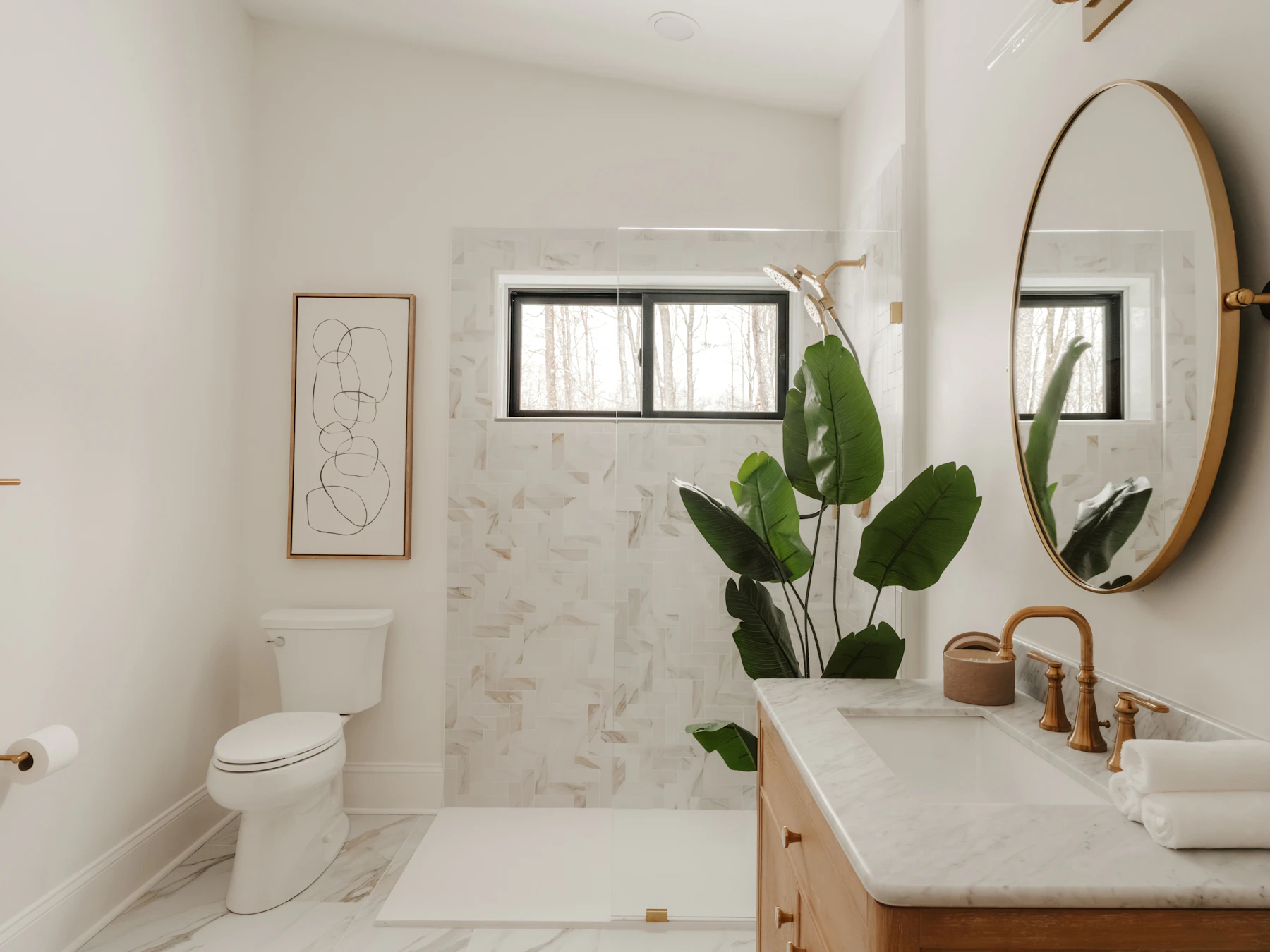 Bathroom with a timber vanity, round mirror and walk-in shower