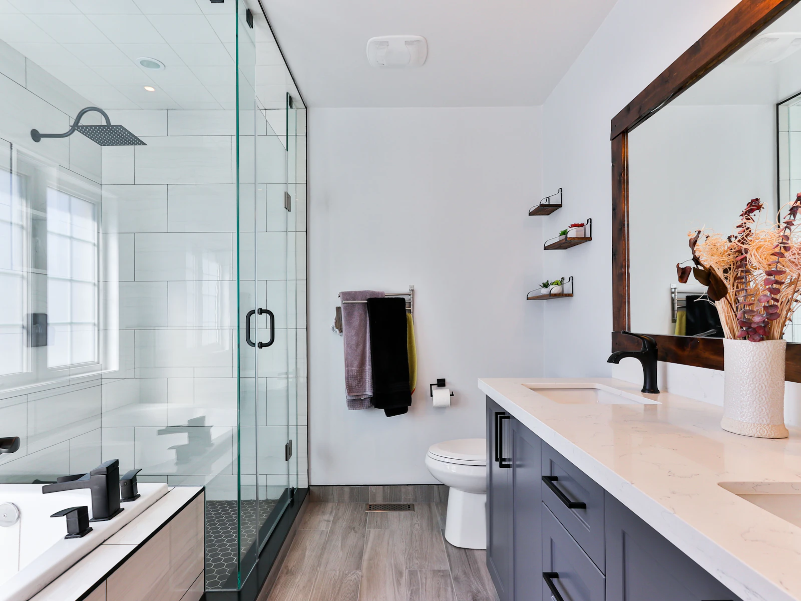Bathroom suite with furniture vanity and glass shower enclosure