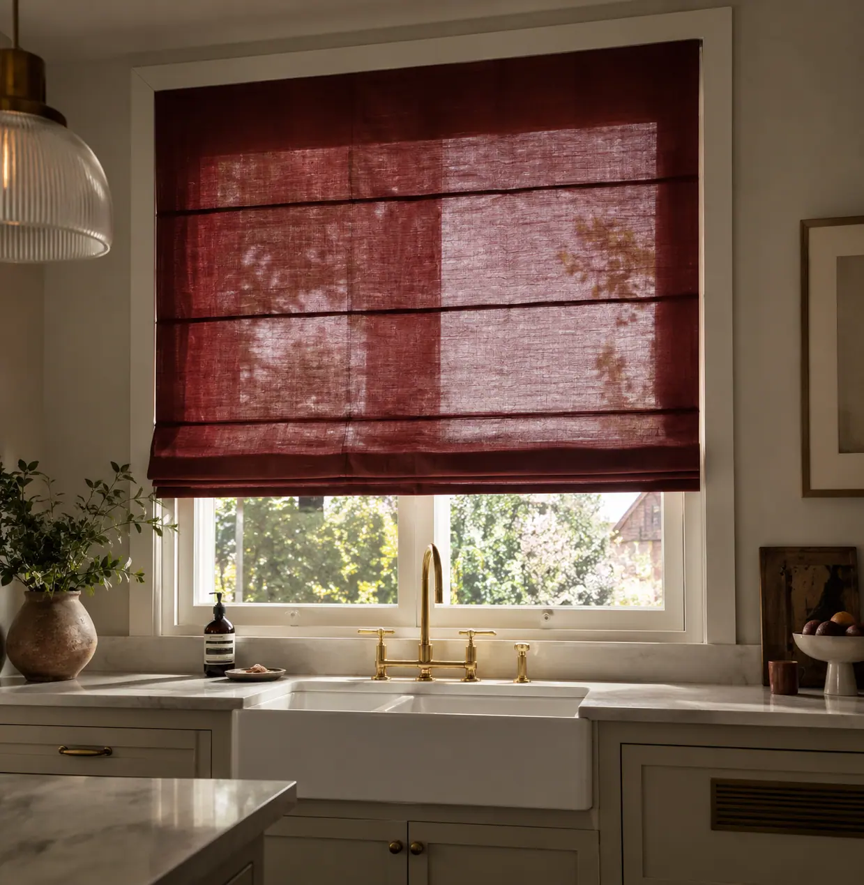 Burgundy linen Roman blind above a kitchen sink