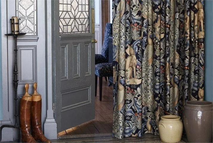 Made-to-measure curtains hung in a living room