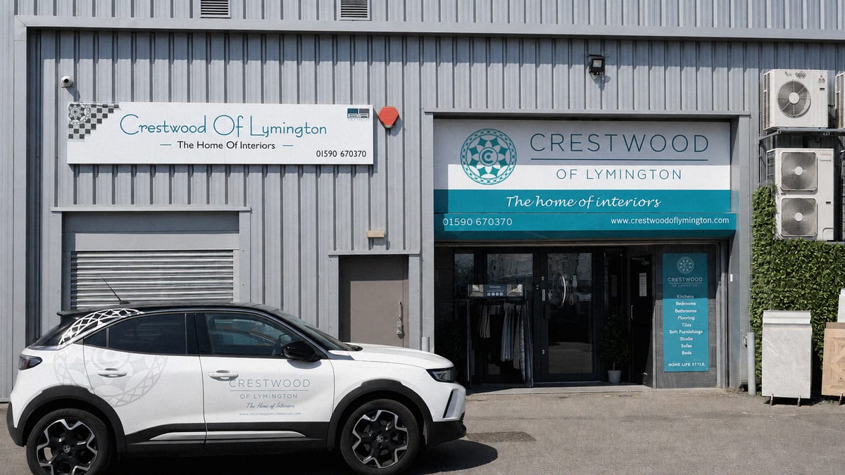Rear entrance of the Crestwood of Lymington showroom with branded signage and parking