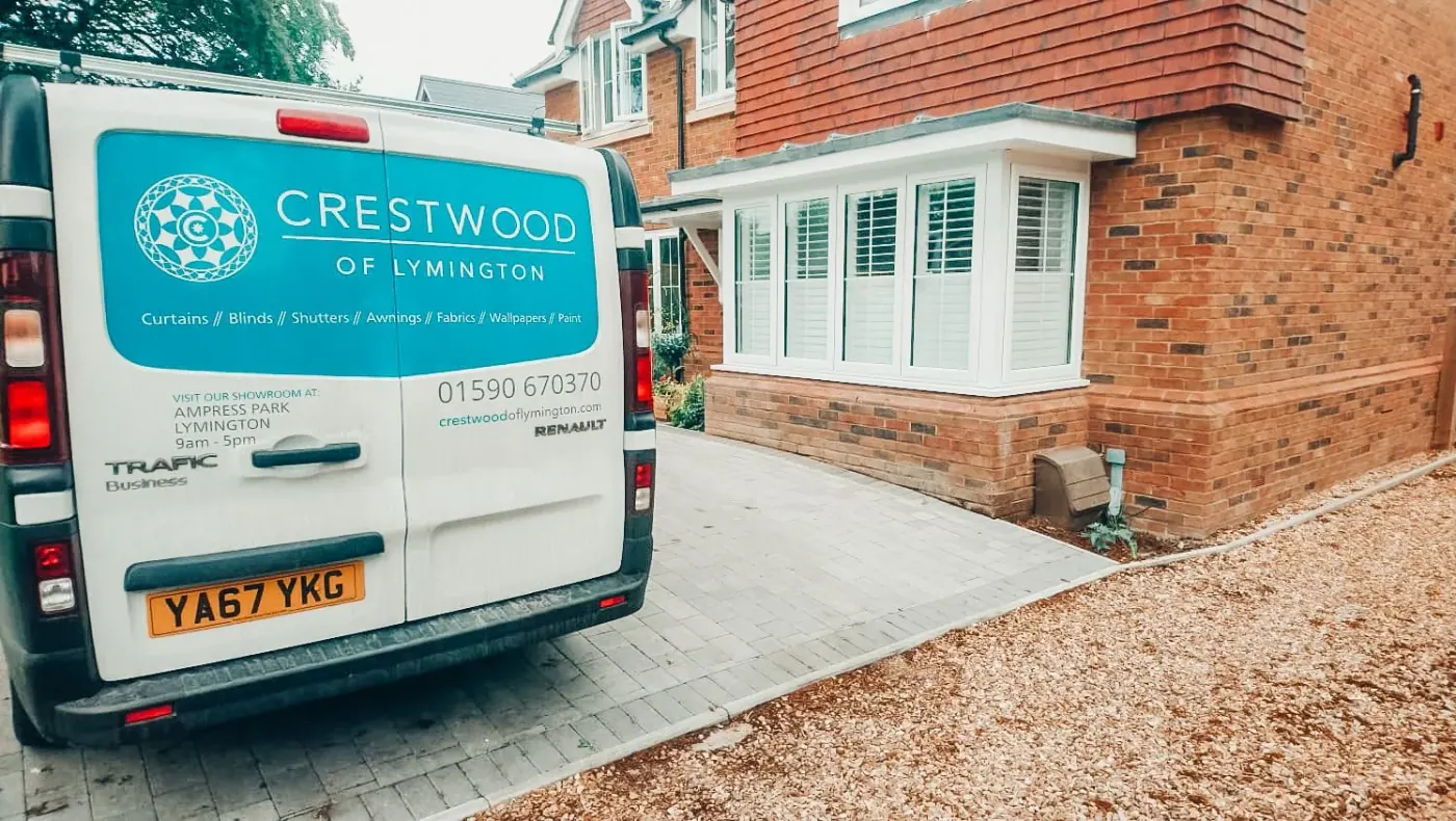 Interior shutters fitted across a bay or multi-panel window, Crestwood of Lymington range